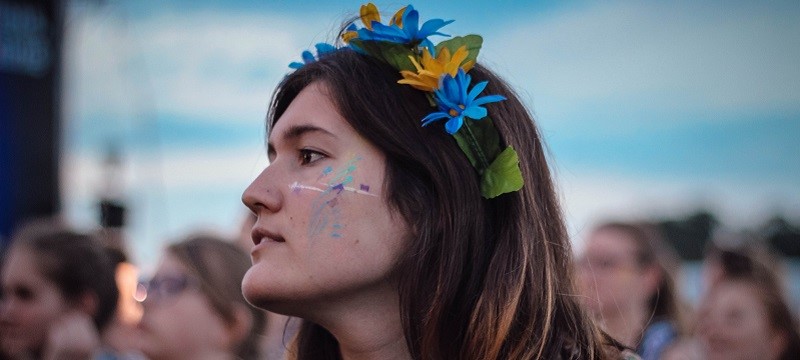Photo of a girl with flowers in her hair.