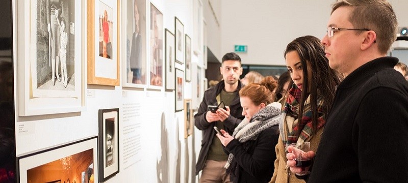 Photo of visitors to the Open Eye Gallery.