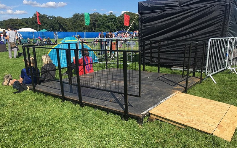 Photo of a low viewing platform at a music festival.
