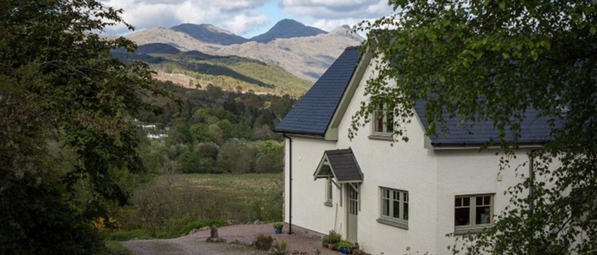 Photo of Bluebell Croft exterior with mountain view.