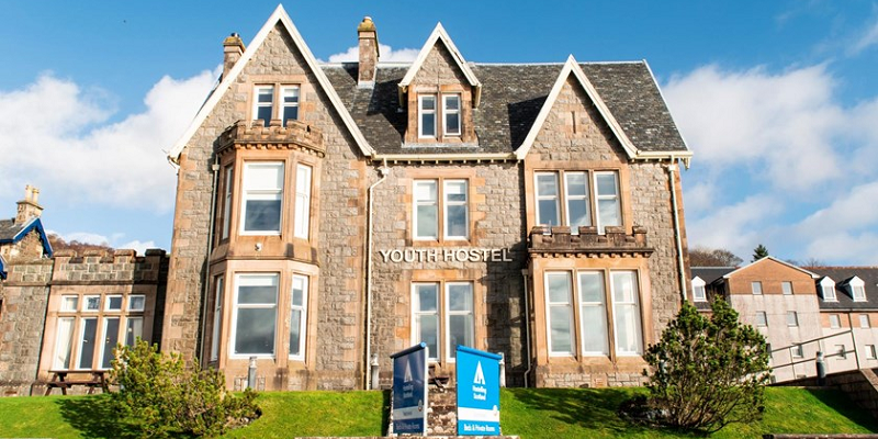 Photo of Oban's Youth Hostel's facade on a sunny day.