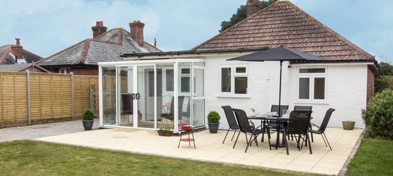 Photo of the back patio of a cottage at Our Bench Cottages, Lymington.