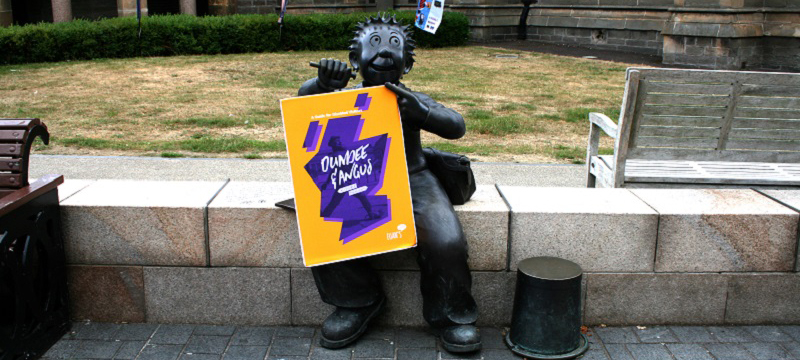 Photo of Euan's Guide Dundee and Angus travel guide with Oor Wullie.