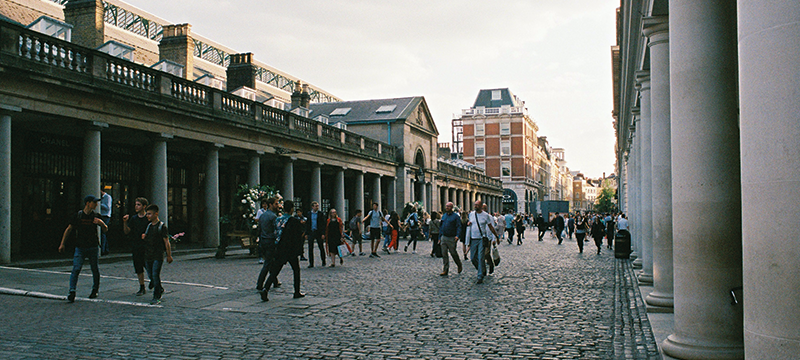 Image showing people on a cobbled street in Covent Garden, London.