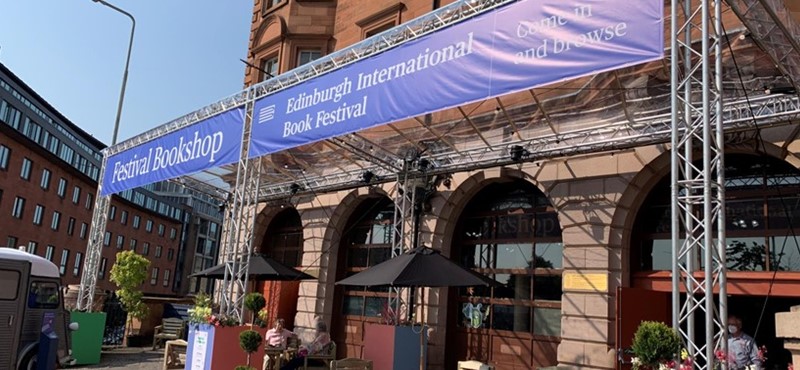 A purple sign at the venue entrance that reads: "Edinburgh International Book Festival".