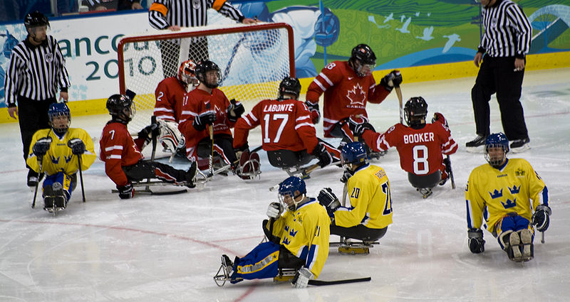 A photo of Canada against Sweden in wheelchair hockey.