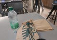 Picture of a Starbucks bag and an empty plastic bottle