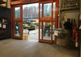 Image of the automatic door leading out into the garden centre showing the sign in the way.