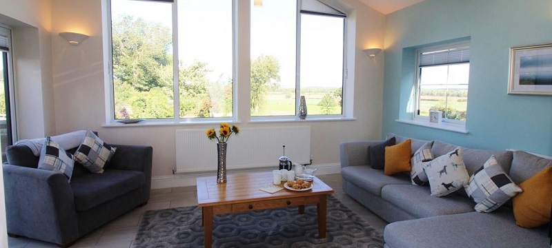 Photo of large windows in sitting room of Wheatlands Cottage.