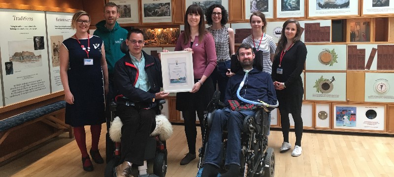 Photo of the award being received at The Scottish Storytelling Centre.