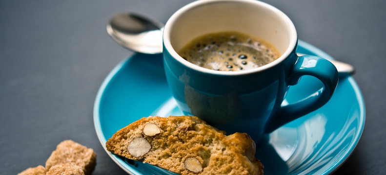 Picture of a cup of coffee and biscuits.
