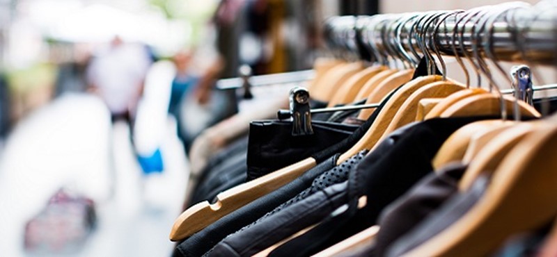 Photo of a rail of clothes.