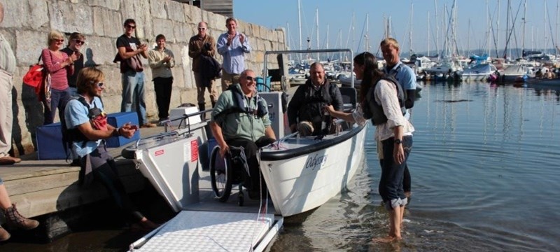 Photo of people on a boat at Mylor Sailing School.