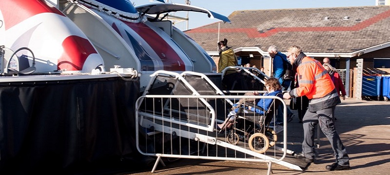 Photo of a wheelchair user boarding the craft.