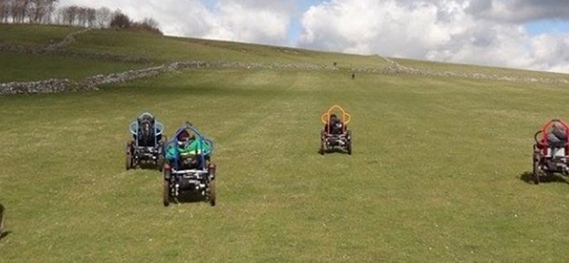Photo of people on off road wheelchairs at Hoe Grange.