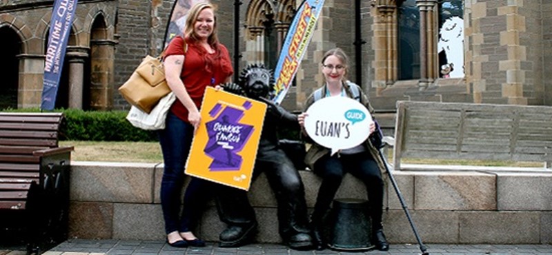 Photo of Hannah and Becca beside Oor Wullie in Dundee.
