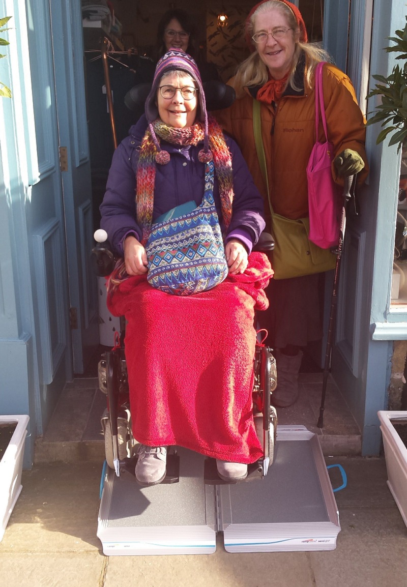 Photo of Judy Davies trying out one of the portable ramps.