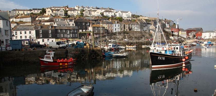 Photo of boats along a Cornish harbour.
