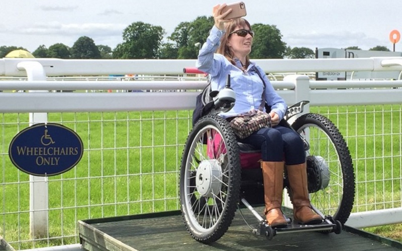 Photo of a wheelchair user on an individual viewing platform.