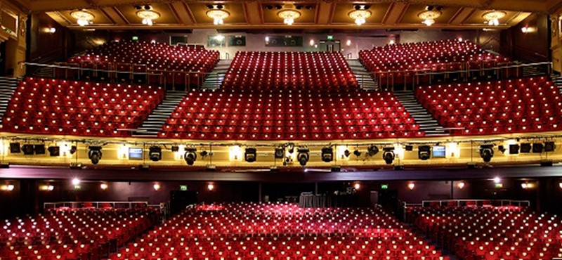 Photo of theatre seats as seen from the stage.