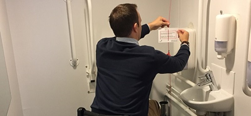 Photo of Ryan attaching Red Cord Card.