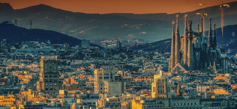 Photo of Barcelona's skyline, taken at sunset.