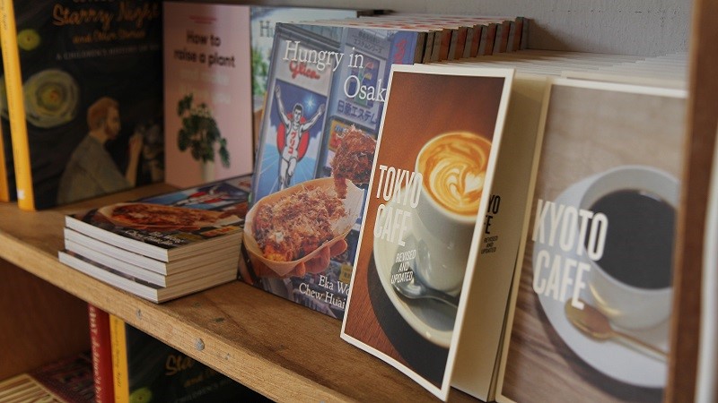 Photo of some books on a shelf.