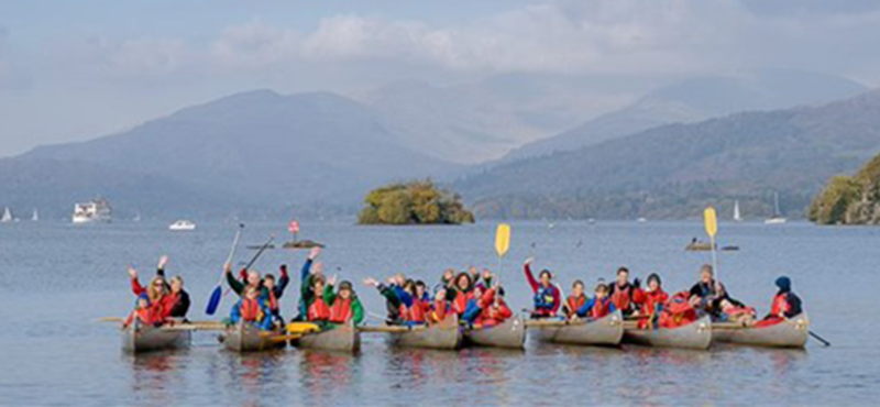 Image of people canoeing on a body of water