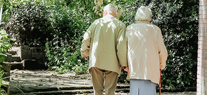 Image of a man and woman walking outside