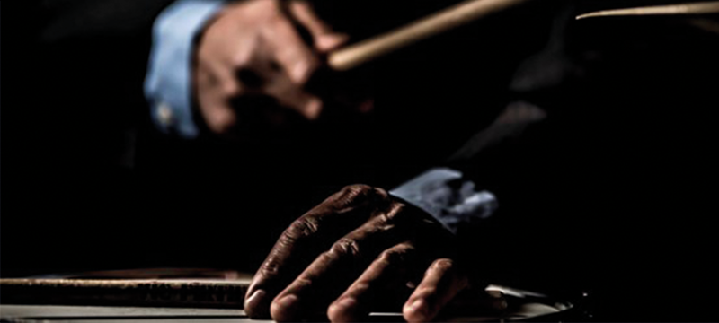 Image of hands holding drum sticks