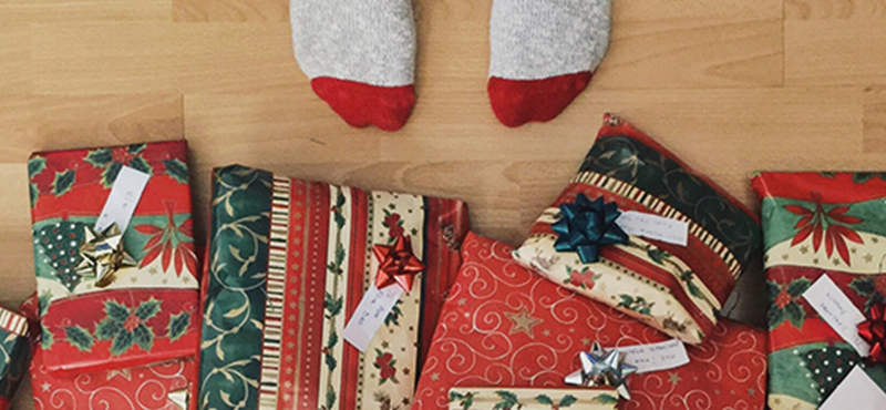 Generic image of wrapped presents on a hardwood floor