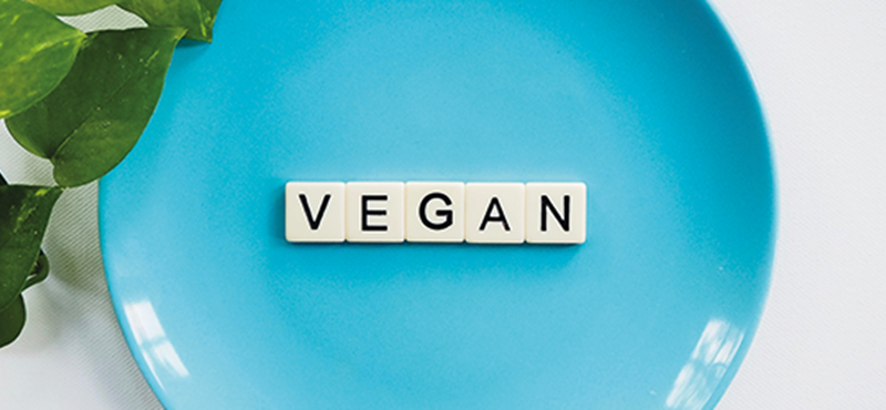 Animated image that spells put VEGAN