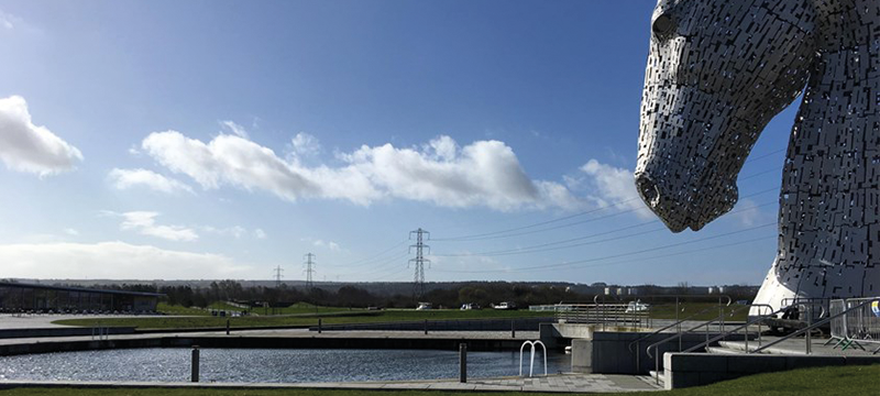 Image of The Kelpies looking out over water and countryside.