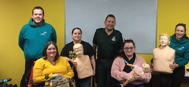 Image of Euan's Guide Ambassadors and team members with the Scottish Ambulance Service.