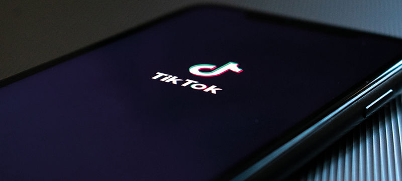 Image of a phone displaying the TikTok logo