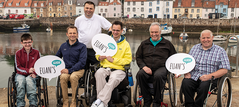 Image of 6 Euan's Guide Ambassadors and team members by the sea.