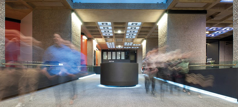 Image of people moving inside the Barbican.