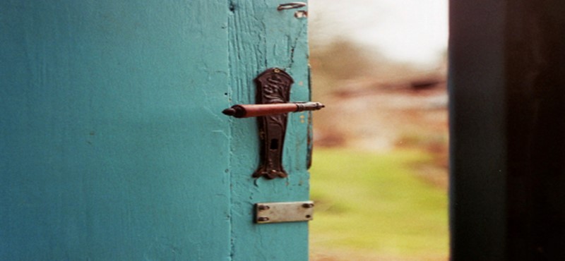 An image of an open door that leads outside. 