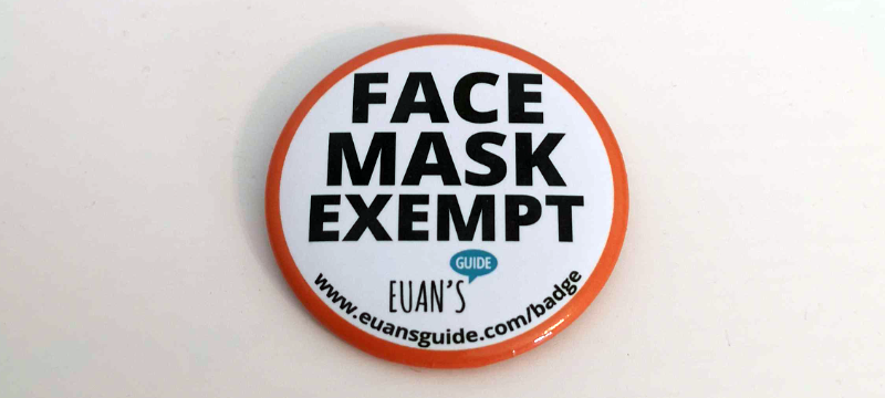 A circular Face Mask Exempt badge with orange outline