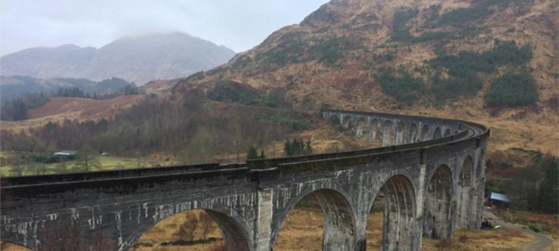 Glenfinnian Viaduct with hills in the background.