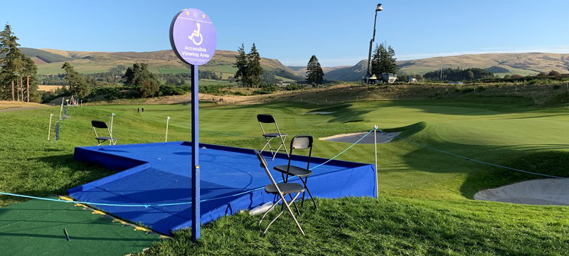 A raised viewing platform with ramped access and a sign indicating that it is an accessible viewing area.