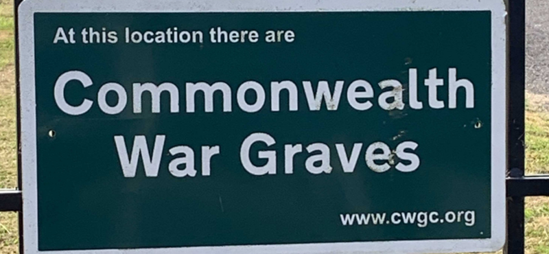 Image of a street sign that says Commonwealth War Graves on it.