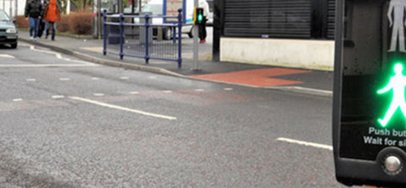 Image of a pedestrian light crossing on green.