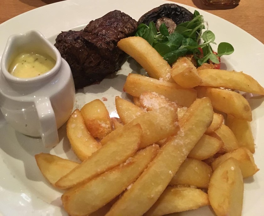 A picture of the steak and fries at Beefeater. With mushroom and diane sauce.