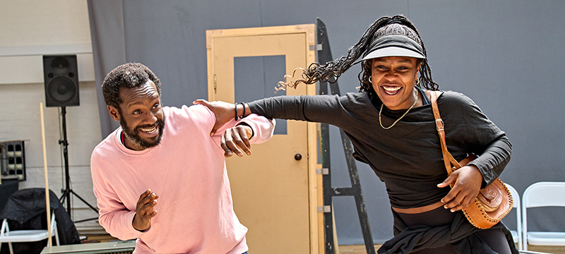 A male actor and a female actor rehearse at The Old Vic