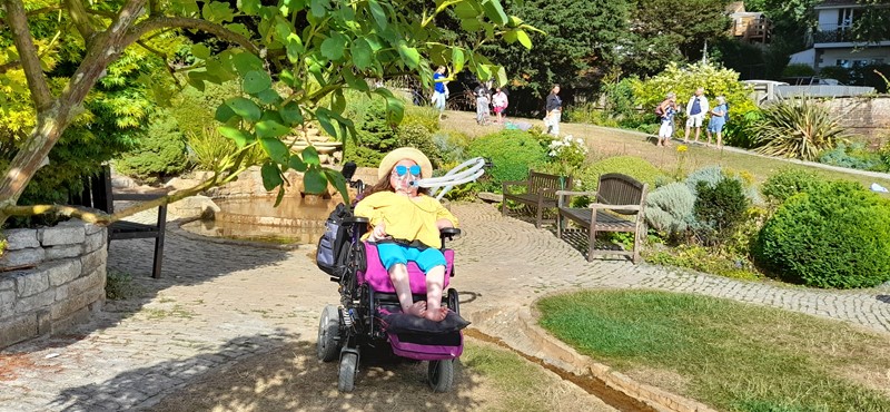 Picture of Karis sitting in the sun at Glastonbury