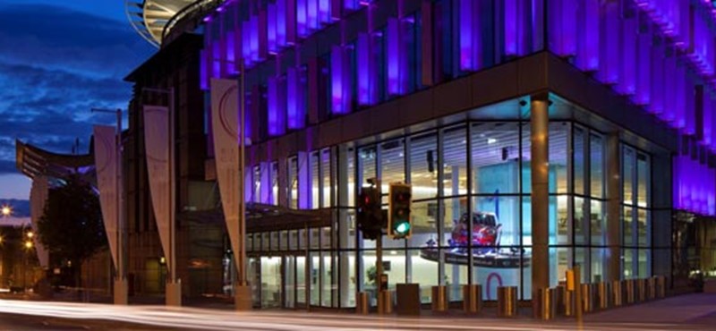 A photo of the Edinburgh International Conference Centre at night.