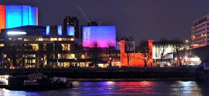 A photo of the National Theatre at night. 