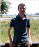 A photo of Euan in a field.