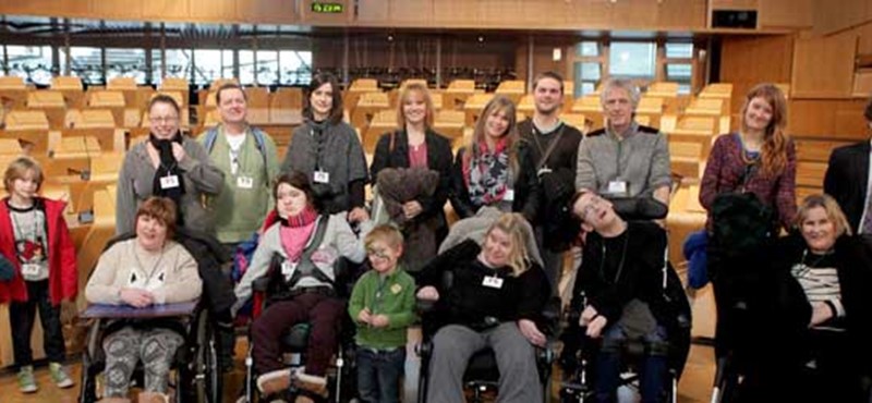 A photo of a group of people at the Scottish Parliament. 